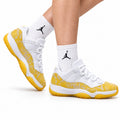 Air Jordan 11 Retro White and Yellow Snakeskin Unisex Sneakers Style 18 on-foot main image