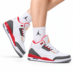 Air Jordan 3 Retro White Fire Red Cement sneakers on feet with Jordan socks