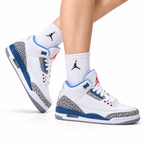 Air Jordan 3 Retro White Royal Blue Cement sneakers on feet with Jordan socks