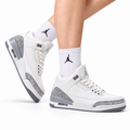 Air Jordan 3 Retro White Sail Cement sneakers on feet with Jordan socks