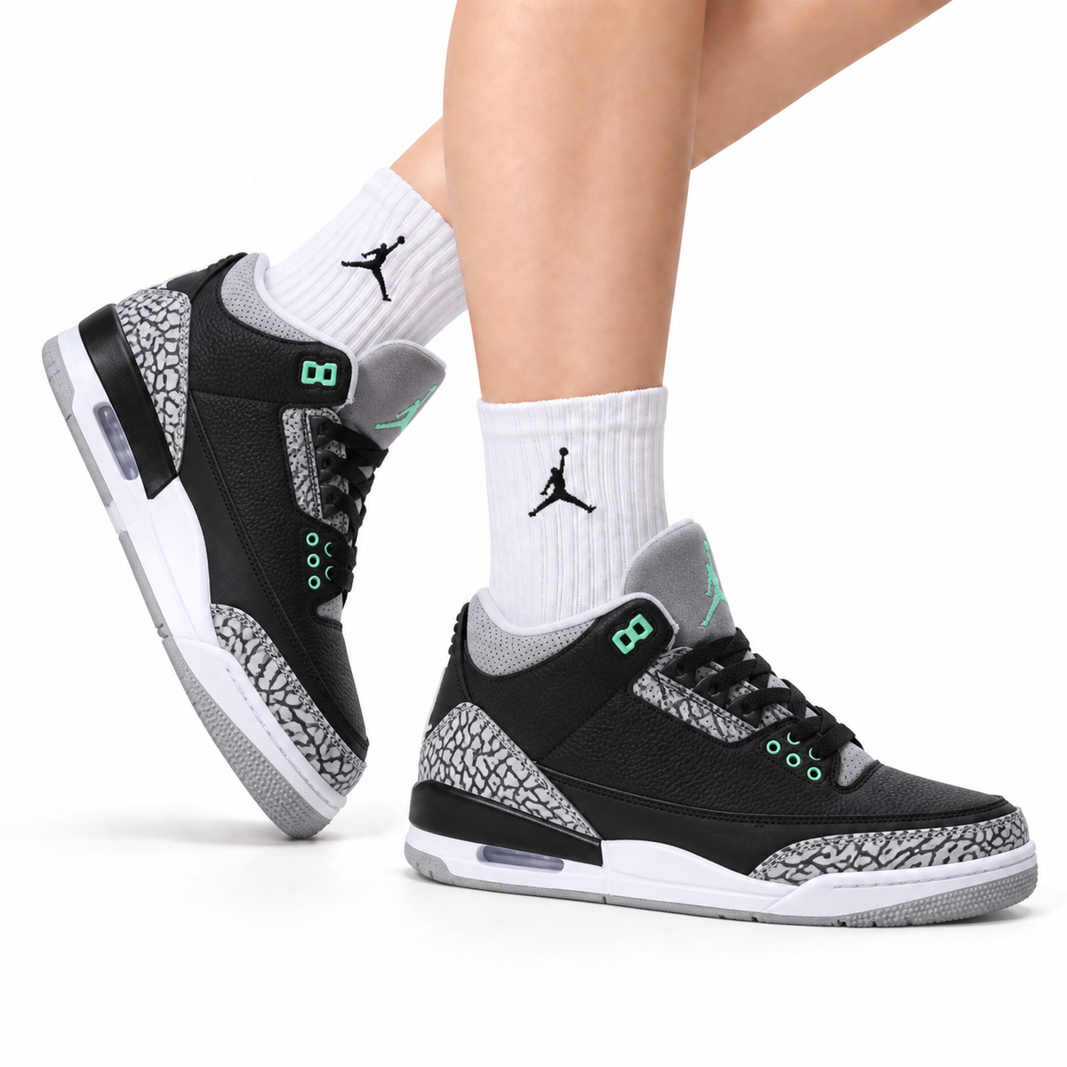 Air Jordan 3 Retro Black Green Cement sneakers on feet with Jordan socks