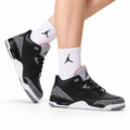 Air Jordan 5 Retro Black Cement Grey Sneakers on-foot product image on a pure white background