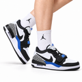 Jordan Legacy 312 Low Black White Royal Blue sneakers on feet with Jordan socks