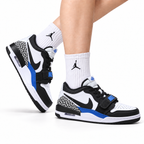 Jordan Legacy 312 Low Black White Royal Blue sneakers on feet with Jordan socks