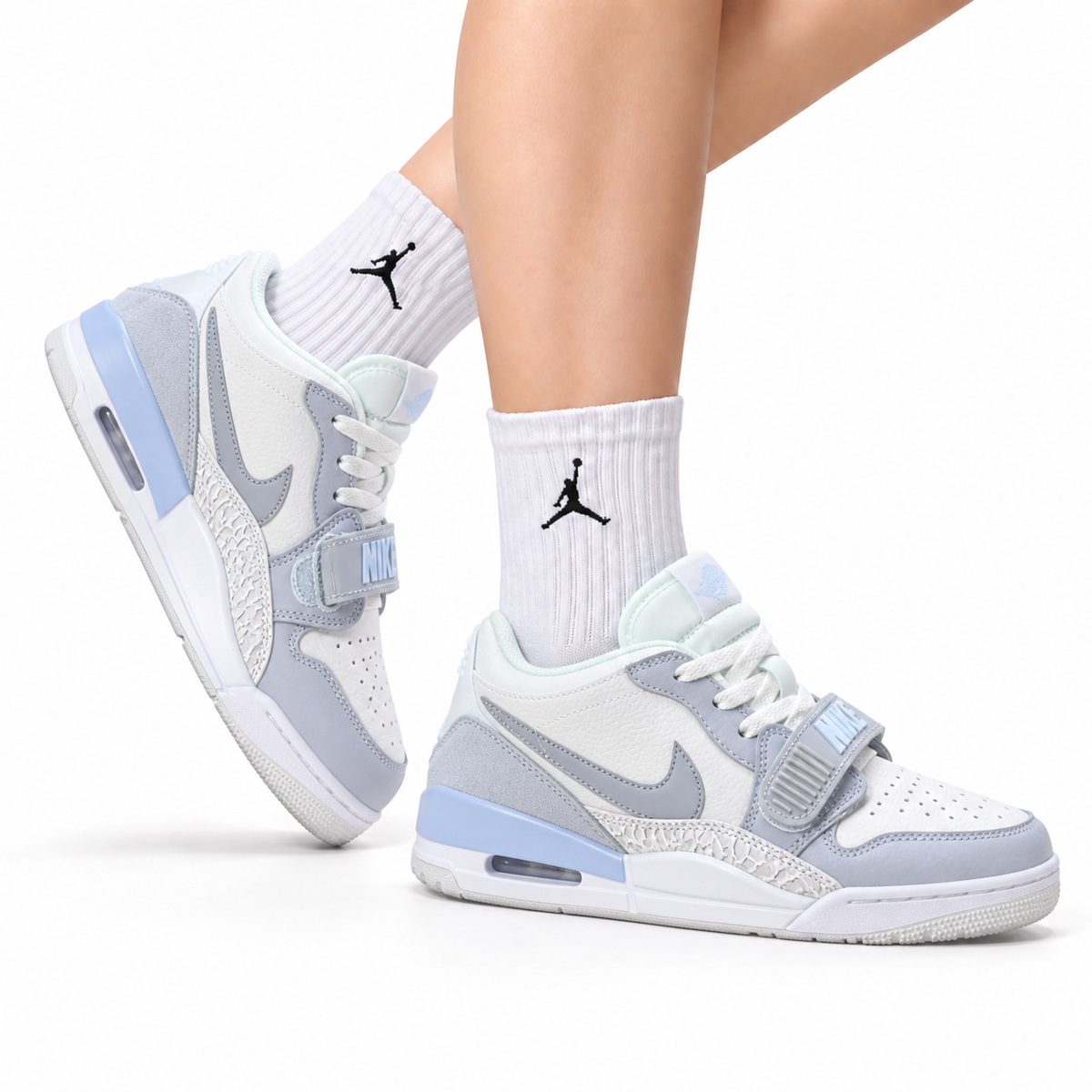 Jordan Legacy 312 Low White Wolf Grey Ice Blue sneakers on feet with Jordan socks