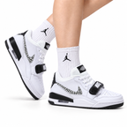 Jordan Legacy 312 Low White Black Cement Grey sneakers on feet with Jordan socks