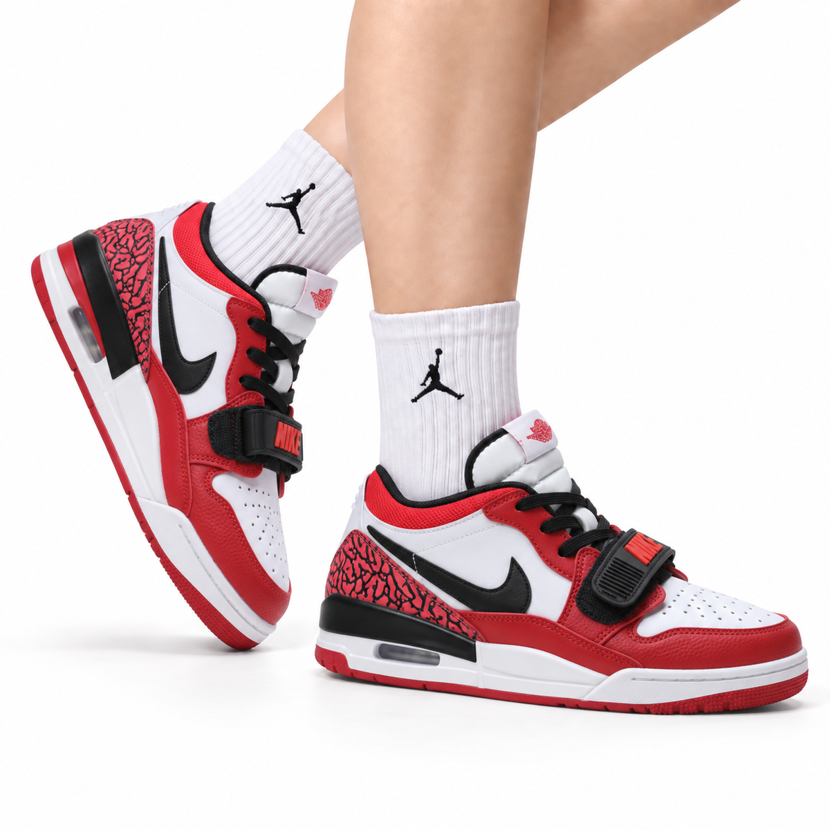 Jordan Legacy 312 Low White University Red Black sneakers on feet with Jordan socks