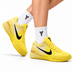 Nike Kobe Yellow Black basketball shoes, on-foot styling illustration